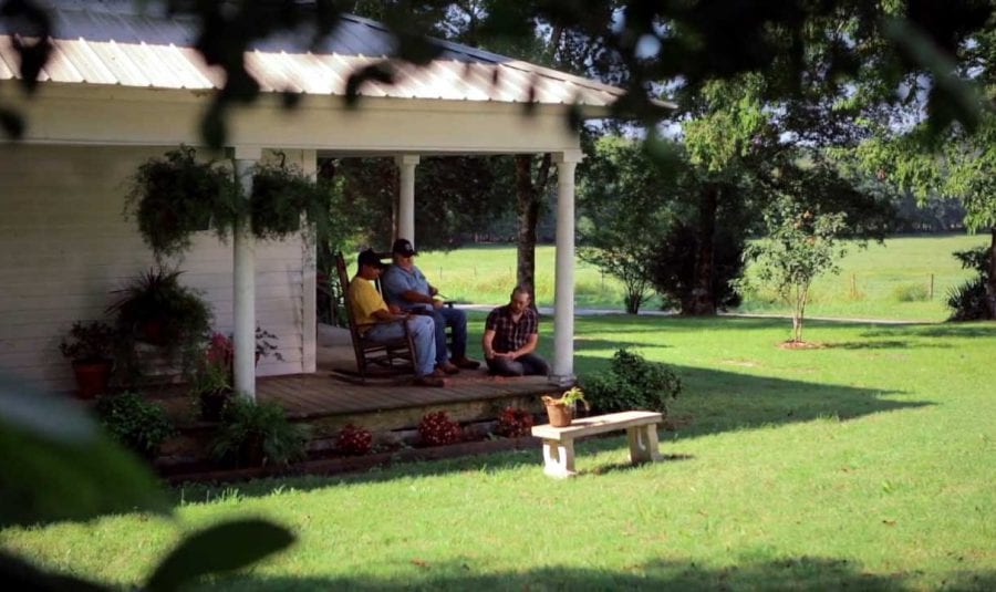 Men on porch whittling