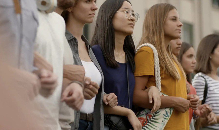 Group of young female protestors standing together outdoors