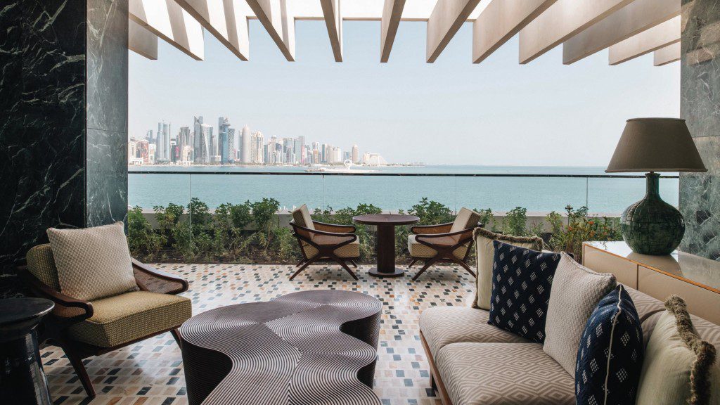 A living room with a view of the city.