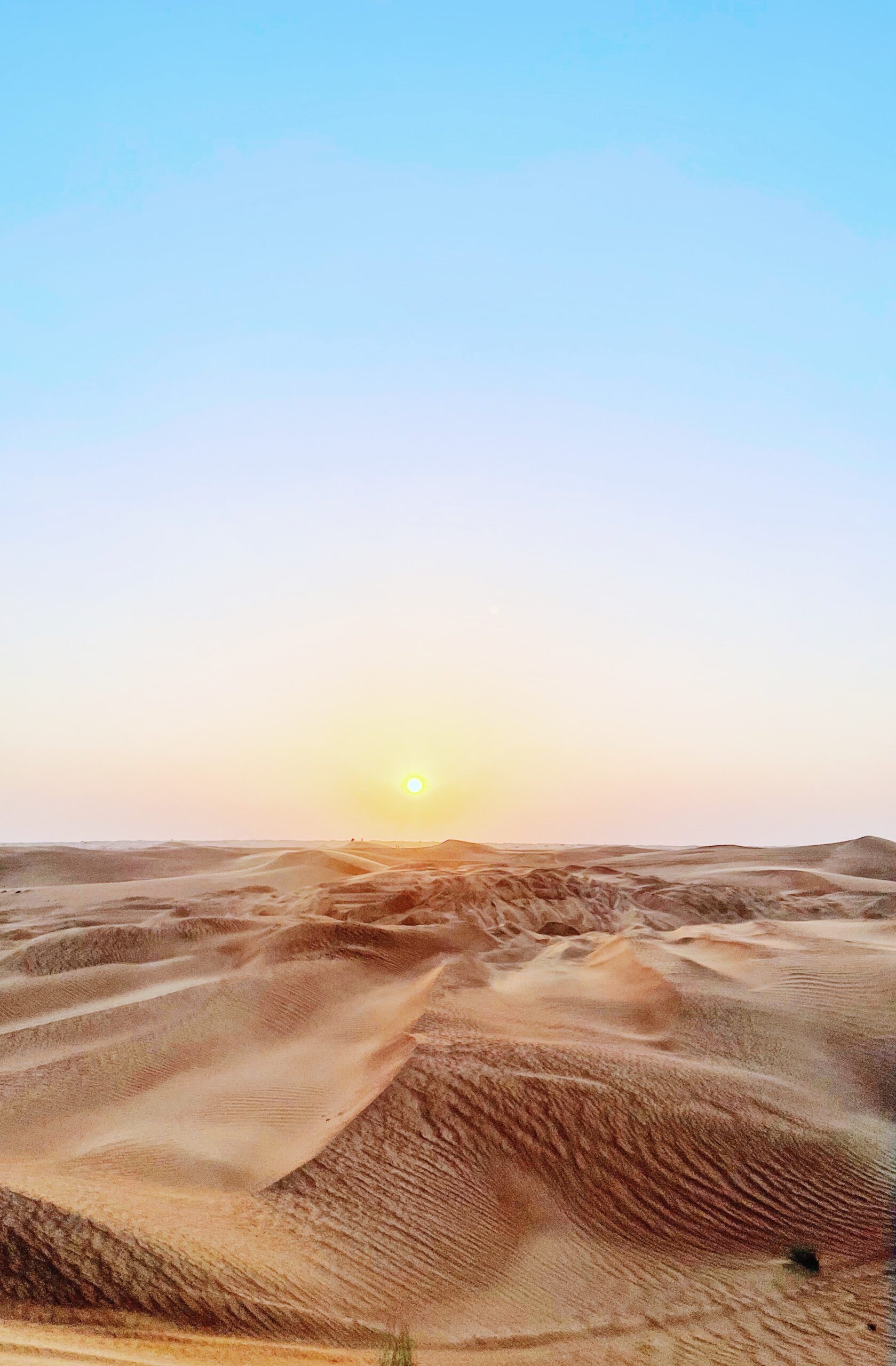 Sunset in a clear sky above a desert in Dubai