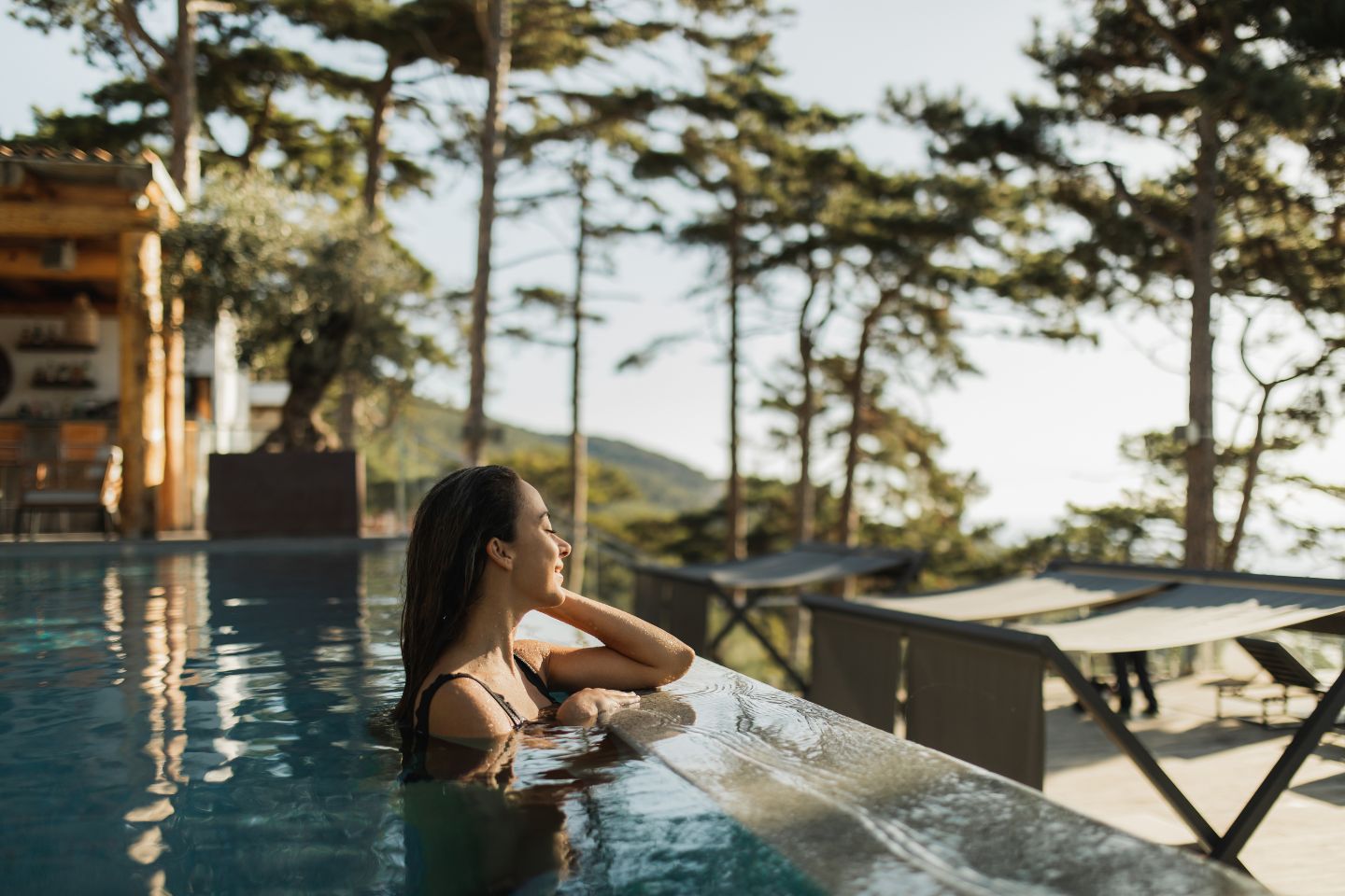 a person is relaxing in the pool at a resort